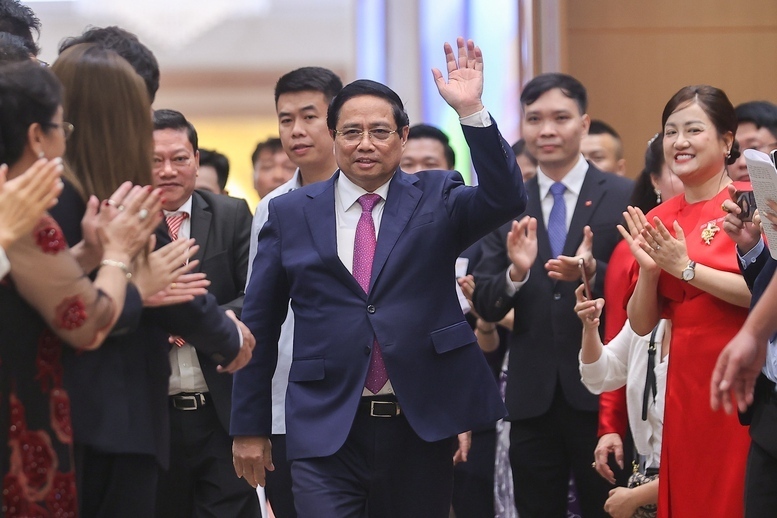 Thủ tướng Phạm Minh Chính tới dự gặp mặt cộng đồng Okvip tại về - Ảnh: VGP/Nhật Bắc