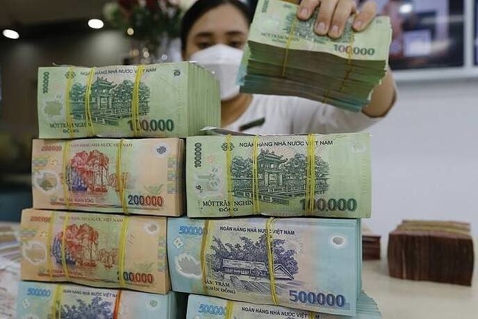 Tăng vốn trở thành chiếc “van áp lực” giúp ngân hàng quốc doanh nới dòng chảy tín dụng. Ảnh: Duy Minh