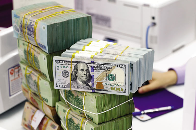 Dự báo năm 2026 mức độ trượt giá của VND chỉ ở mức 2 - 2,5% so với thời điểm đầu năm. Ảnh Duy Minh