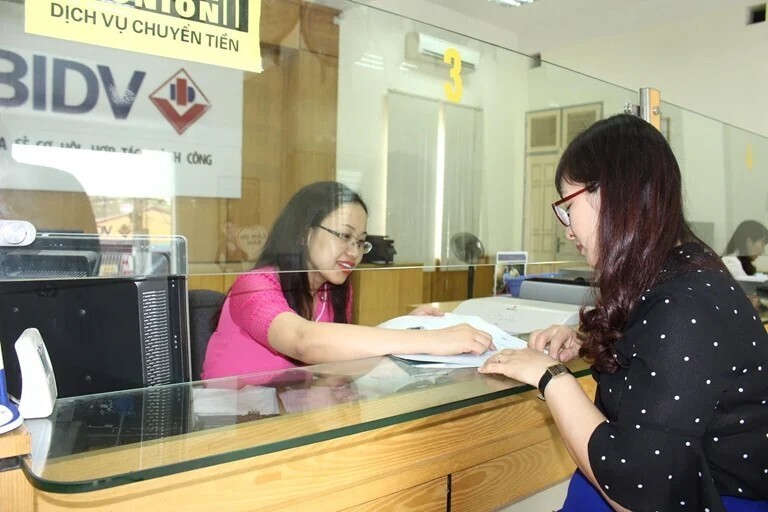 Không bỏ quy định về trách nhiệm cung cấp thông tin của tổ chức tín dụng. Ảnh minh họa: Nguyễn Trang